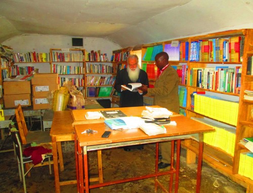 Archbishop Makarios Admires books at Orthodox Mission education centre
